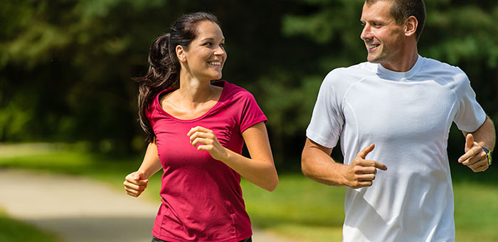 Husband and Wife out on a jog follow health advice from Akron chiropractor