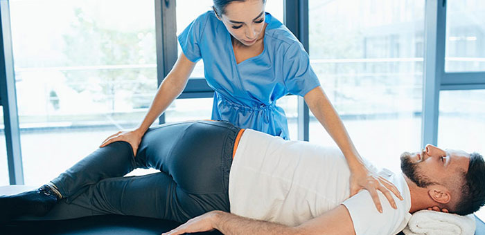 Patient receiving sciatica treatment from Akron chiropractor