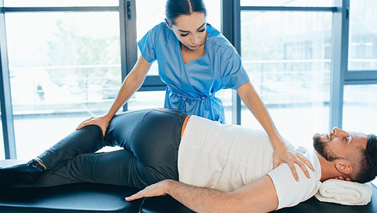 Patient receiving sciatica treatment from Akron chiropractor